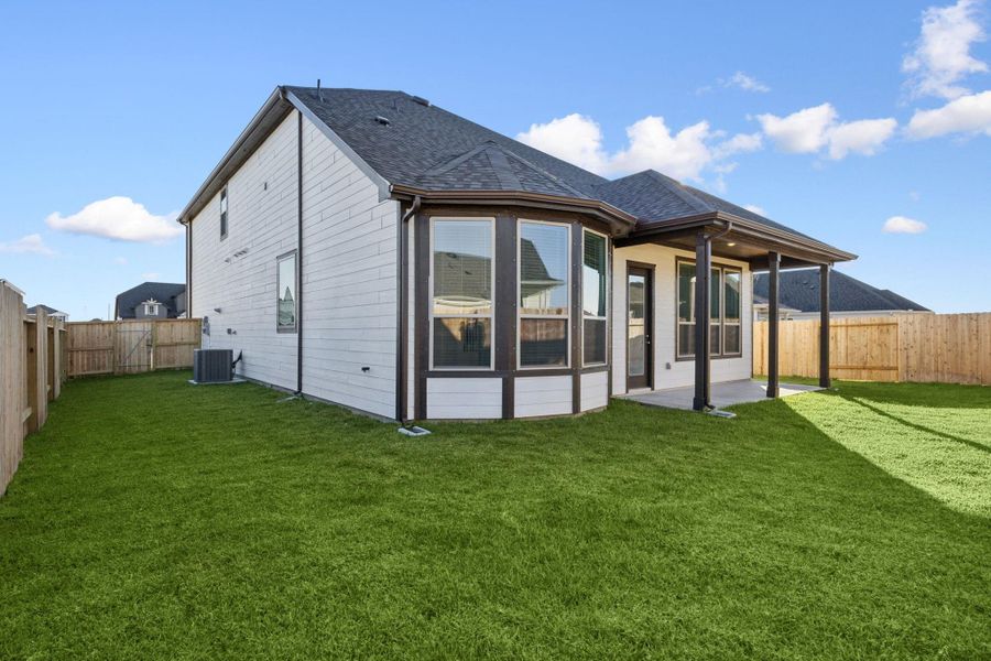 Exterior details and patio area of a home in Windcress, Cove (Image 3).