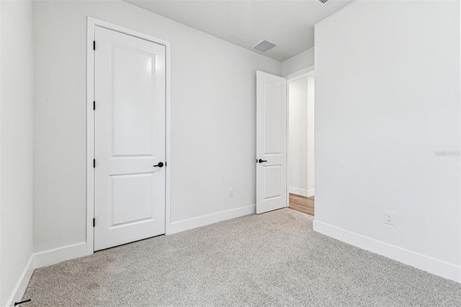 Spacious, unfurnished interior of a new home in The Peninsula at Rhodine Lake, Riverview (Image 29).