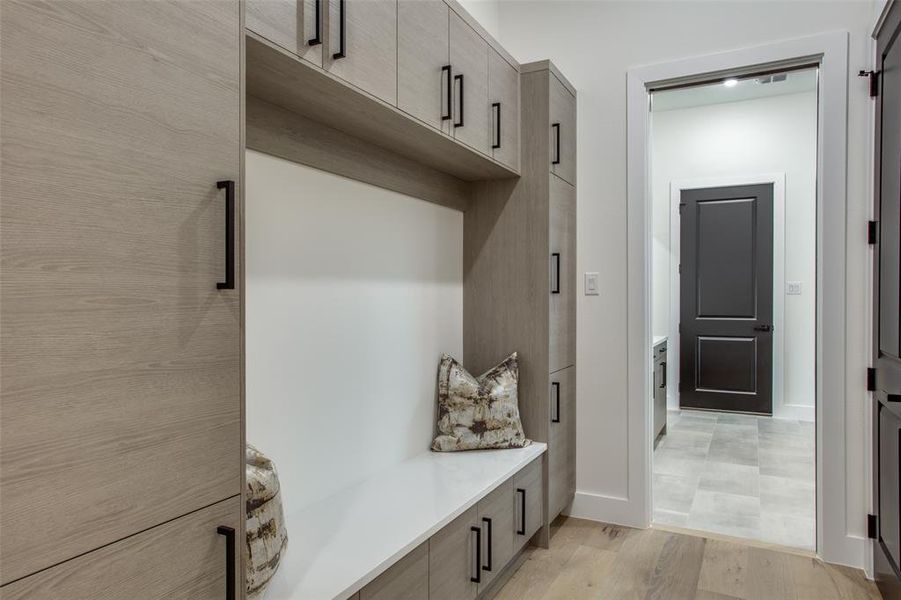 Mudroom with light wood-type flooring