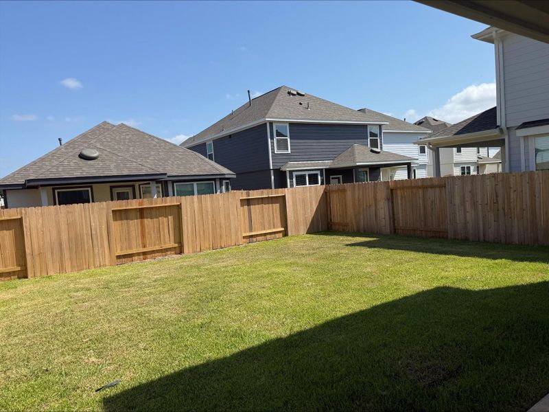 Exterior details and patio area of a home in River's Edge, Conroe (Image 3).