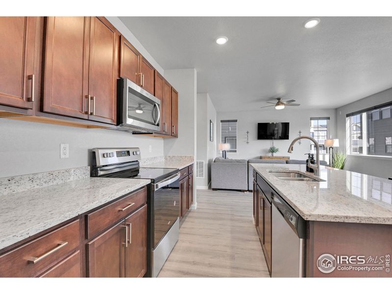 Solid granite countertops, SS Whirlpool appliances and Samsung French Door Refrigerator.