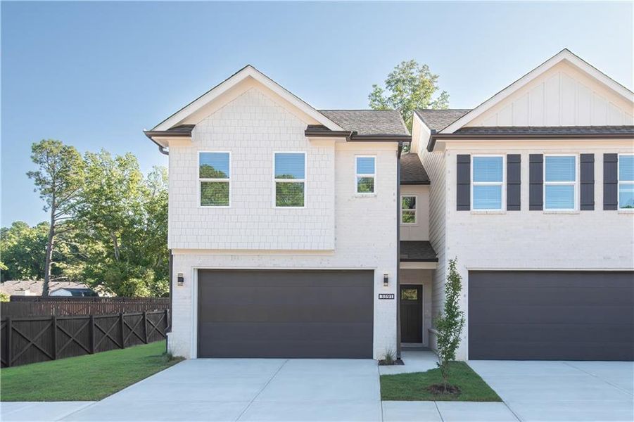 Front exterior of a new home in , Snellville, GA, highlighting curb appeal (Image 2).