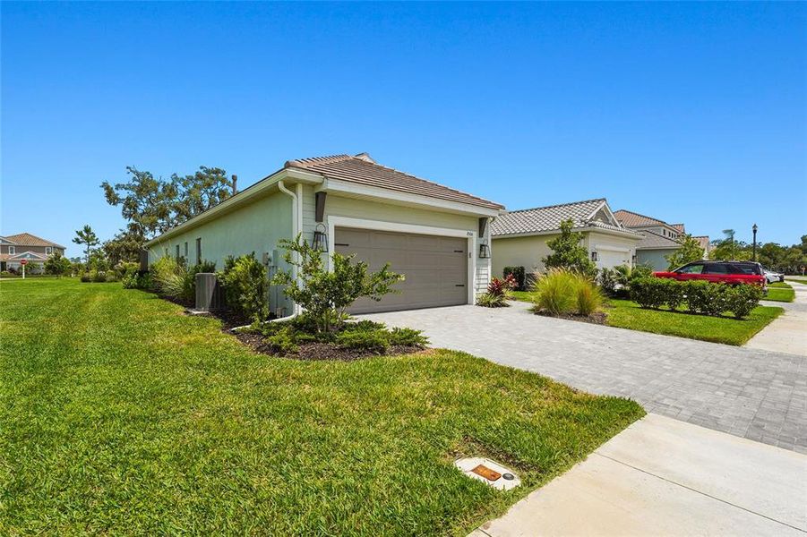 Front exterior of a new home in , Sarasota, FL, highlighting curb appeal (Image 29).