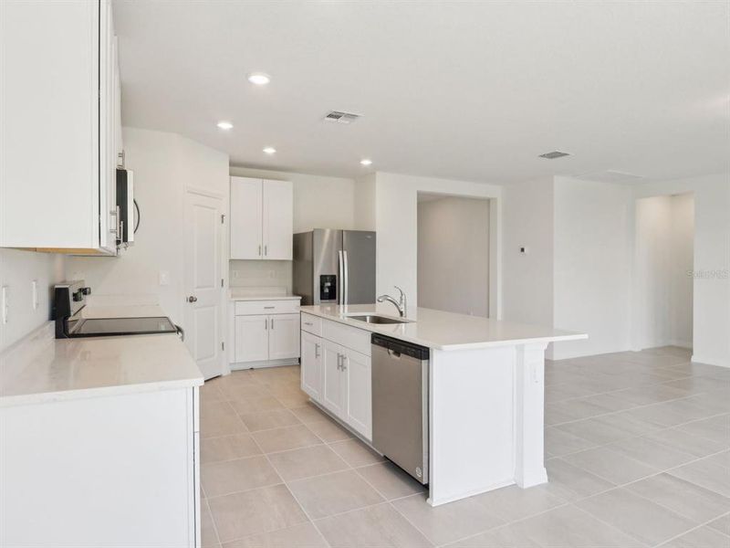 Furnished interior view inside a new home in The Reserve at Van Oaks, Auburndale (Image 11).