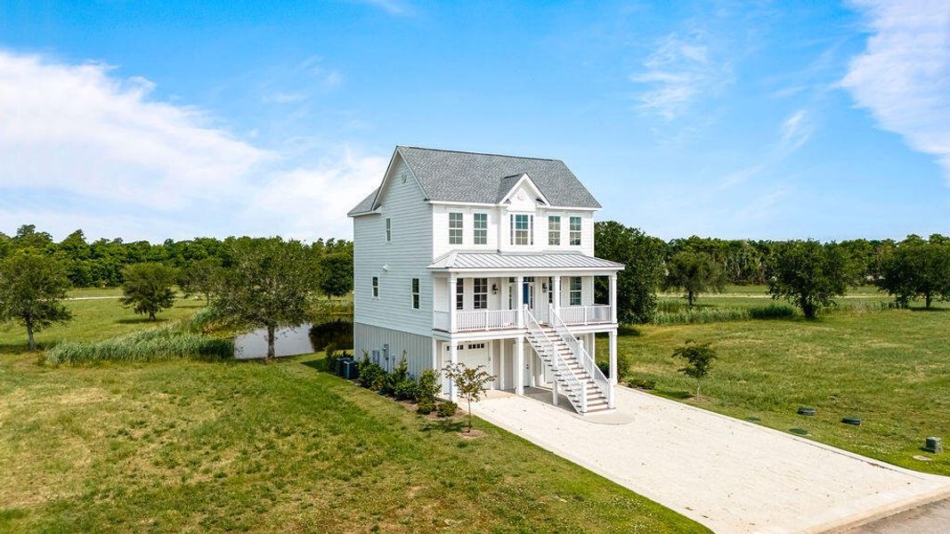 Front exterior of a new home in , Georgetown, SC, highlighting curb appeal (Image 24).