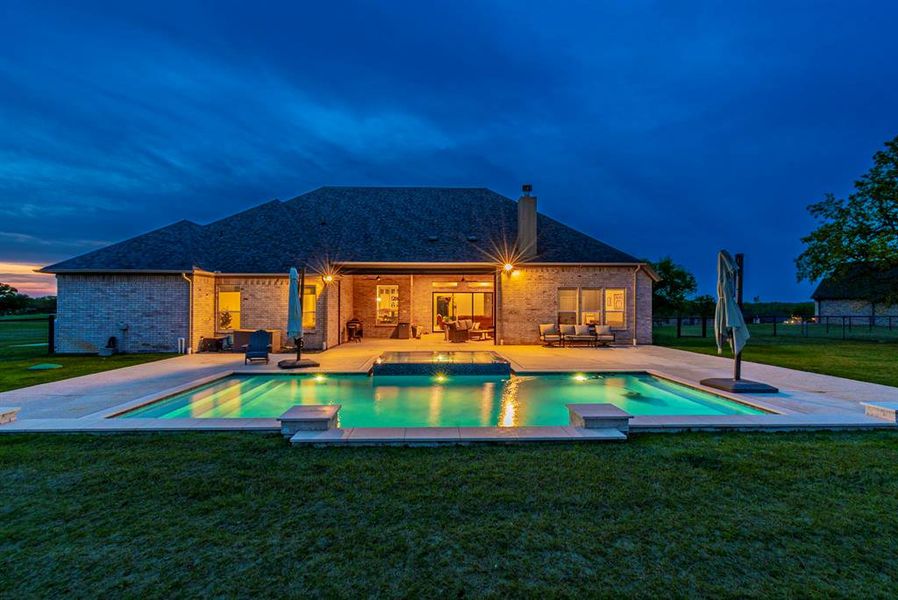 Integrated pool / spa featuring a patio area and outdoor seating Integrated pool / spa featuring a patio area and outdoor seating