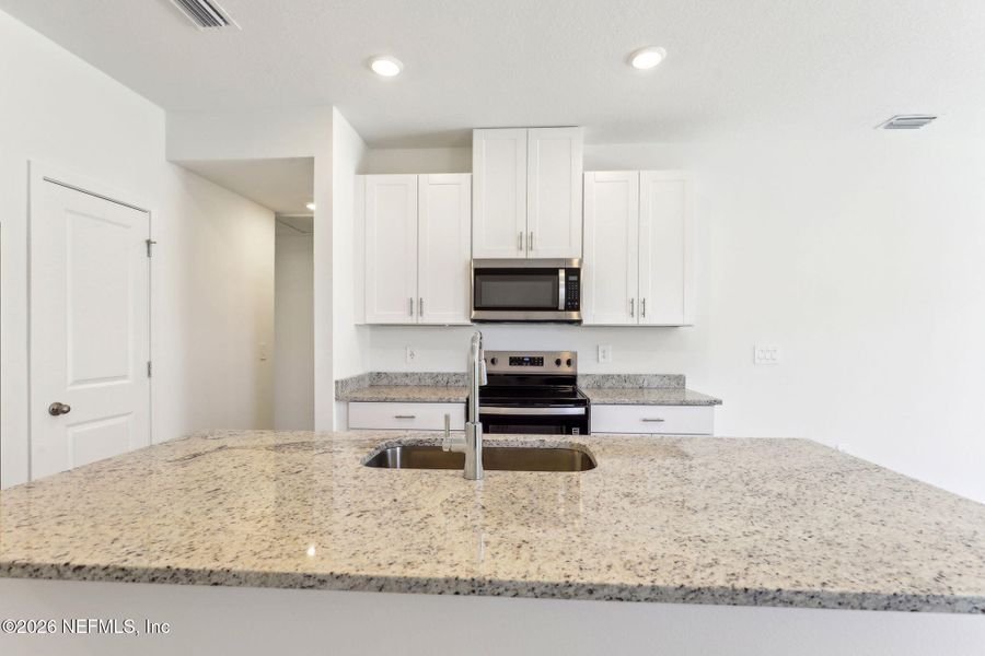 Furnished interior view inside a new home in Flagler Village - Classic Series, Palm Coast (Image 5).