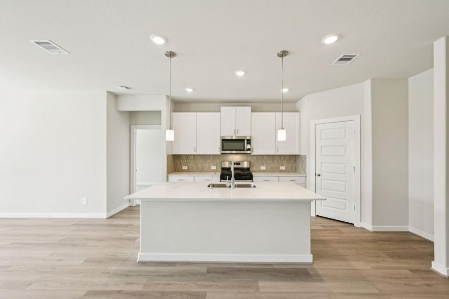 Furnished interior view inside a new home in Landing Meadows - Premier Series, New Caney (Image 5). Furnished interior view inside a new home in Landing Meadows - Premier Series, New Caney (Image 5).