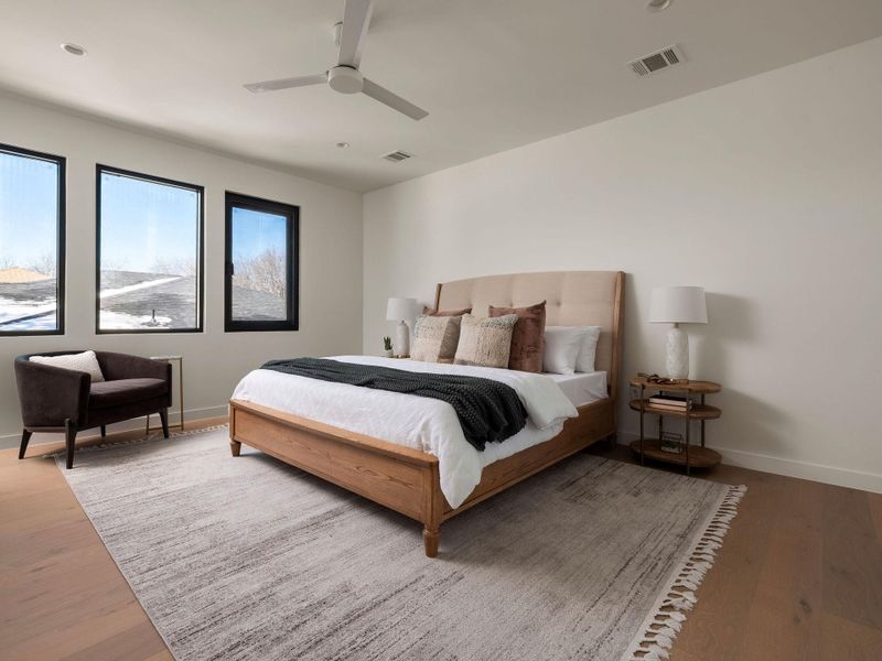 Bedroom featuring wood finished floors and a ceiling fan