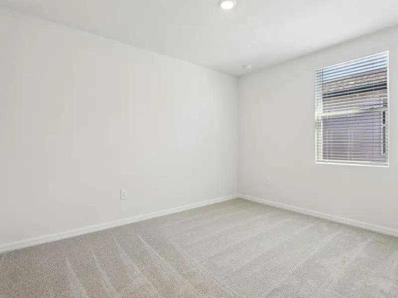 Spacious, unfurnished interior of a new home in Villamar - Signature Series, Winter Haven (Image 11).