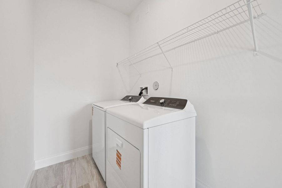 Furnished interior view inside a new home in Brystol at Wylder - Reserve Series, Port St. Lucie (Image 7).