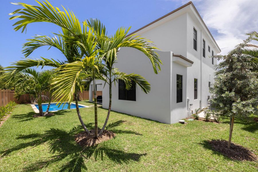 Front exterior of a new home in , Palm Beach Shores, FL, highlighting curb appeal (Image 2). Front exterior of a new home in , Palm Beach Shores, FL, highlighting curb appeal (Image 2).