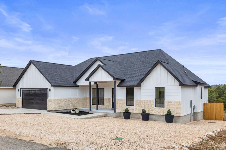 Front exterior of a new home in , Wimberley, TX, highlighting curb appeal (Image 2).