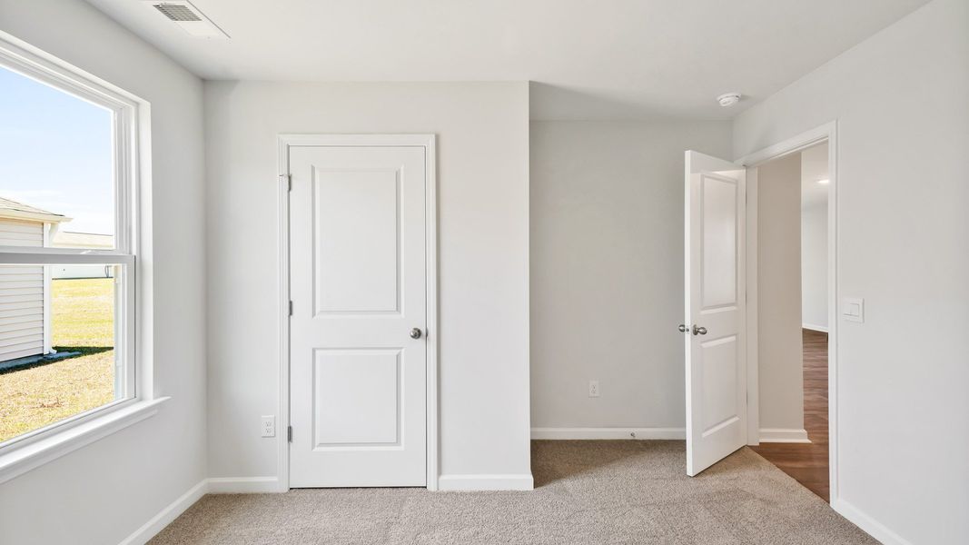 Spacious, unfurnished interior of a new home in Lockwood Landing, Supply (Image 19). Spacious, unfurnished interior of a new home in Lockwood Landing, Supply (Image 19).
