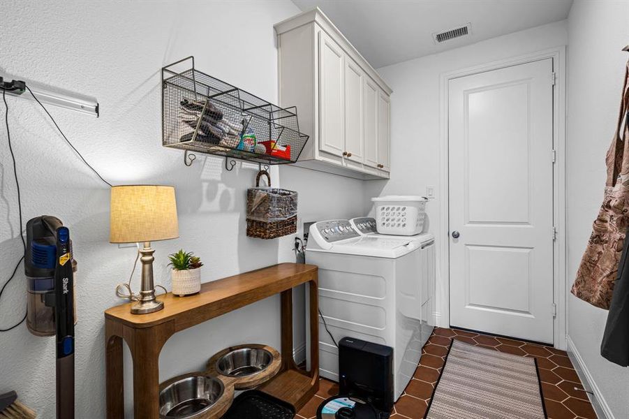 Laundry room with storage and room for extra items. Laundry room with storage and room for extra items.