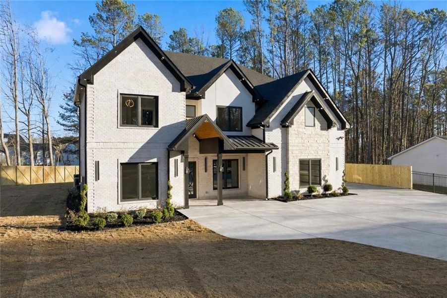 Front exterior of a new home in , Lawrenceville, GA, highlighting curb appeal (Image 31).