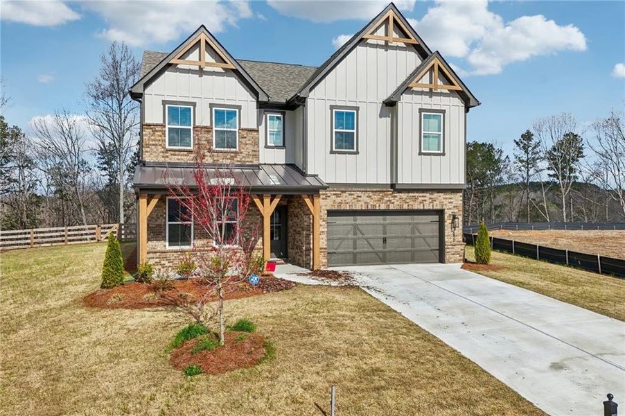 Front exterior of a new home in Tiberon Woods, Cumming, GA, highlighting curb appeal (Image 31). Front exterior of a new home in Tiberon Woods, Cumming, GA, highlighting curb appeal (Image 31).