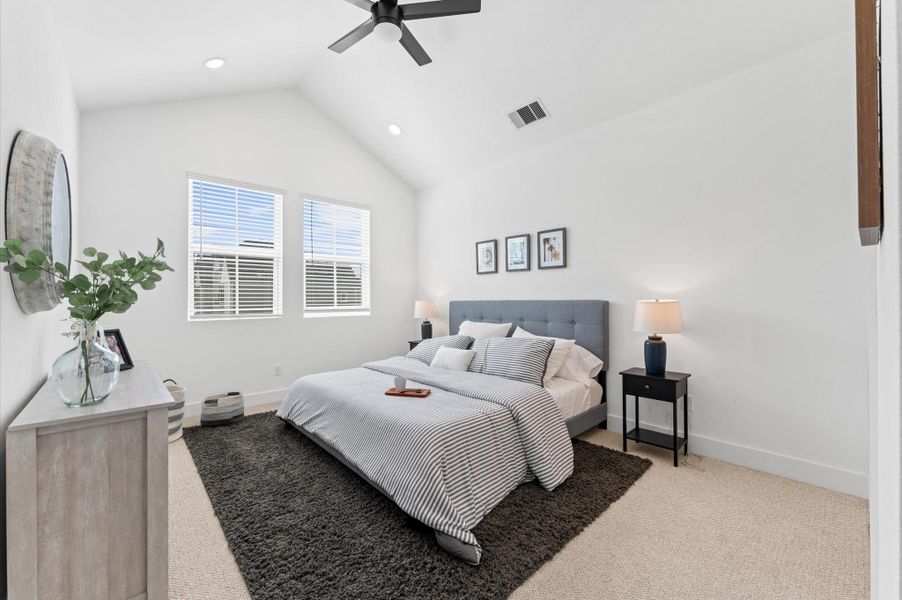 Retreat to the luxurious primary bedroom where cathedral ceilings and expansive windows create an airy, light-filled sanctuary. Wake up to tranquil courtyard views offering a daily dose of greenery and calm.