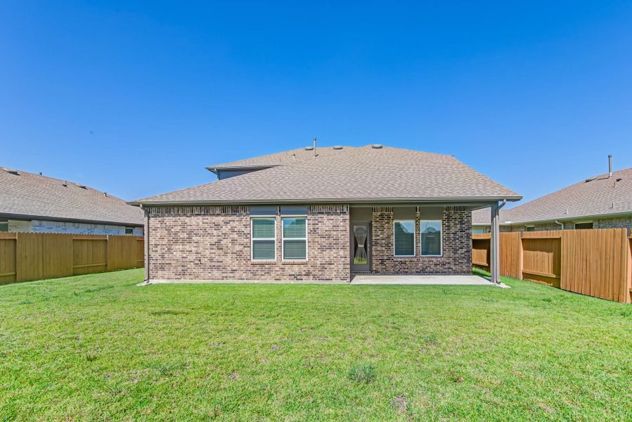 Front exterior of a new home in River Ranch Meadows, Dayton, TX, highlighting curb appeal (Image 26).