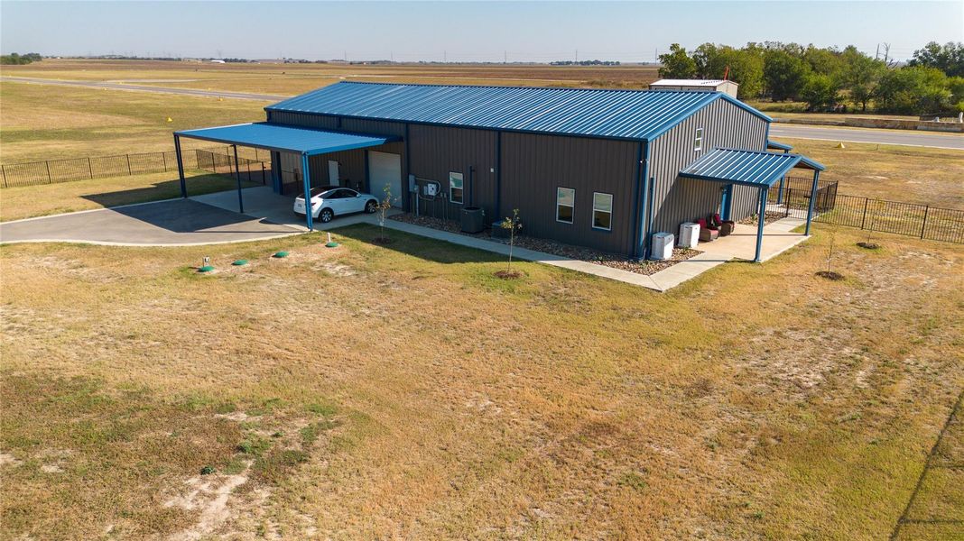 Covered parking and side patio featured at the home Covered parking and side patio featured at the home