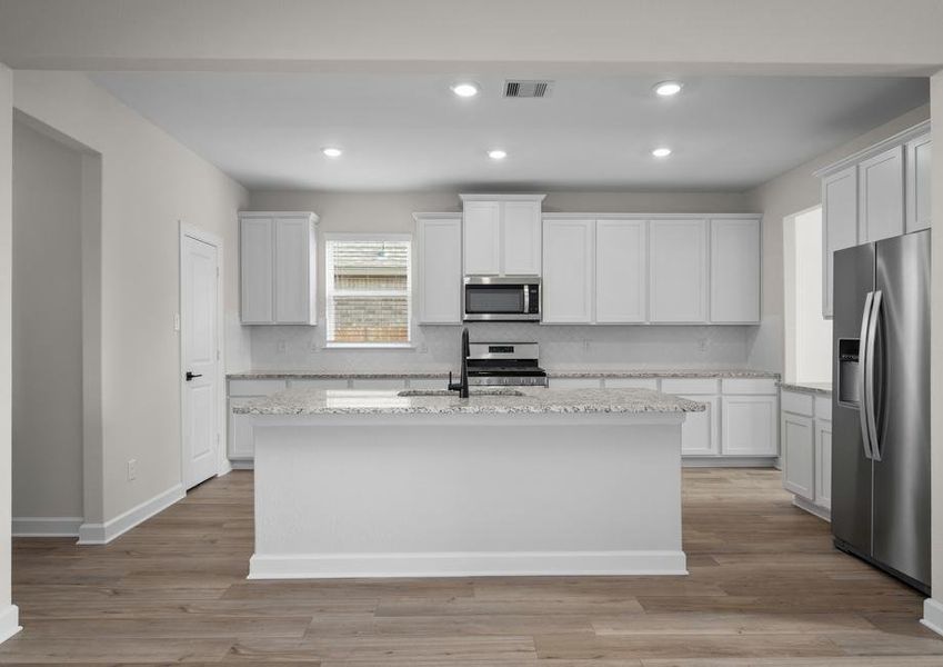 Chef ready kitchen with white cabinets and stainless steel appliances