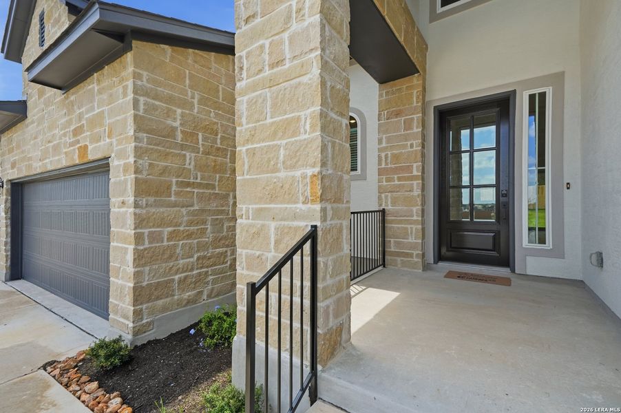 Exterior details and patio area of a home in The Reserve at Potranco Oaks, Castroville (Image 26).