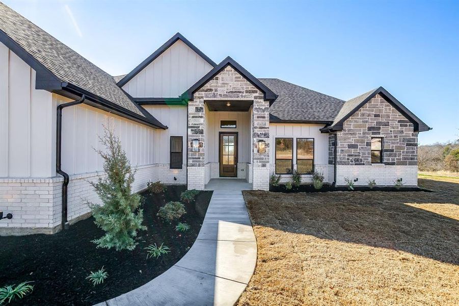 Front exterior of a new home in , Weatherford, TX, highlighting curb appeal (Image 24).