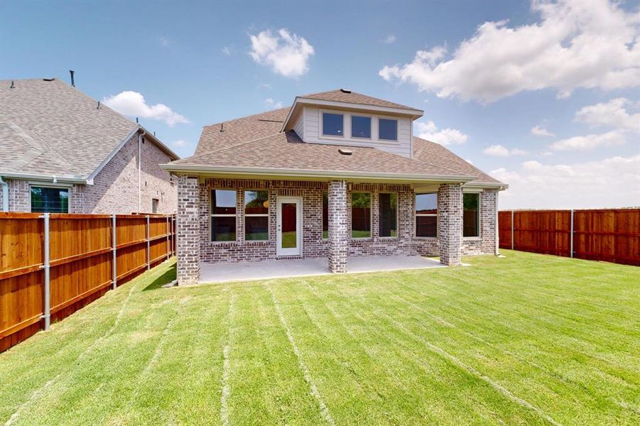 Front exterior of a new home in Lilybrooke at Legacy Hills, Celina, TX, highlighting curb appeal (Image 22).