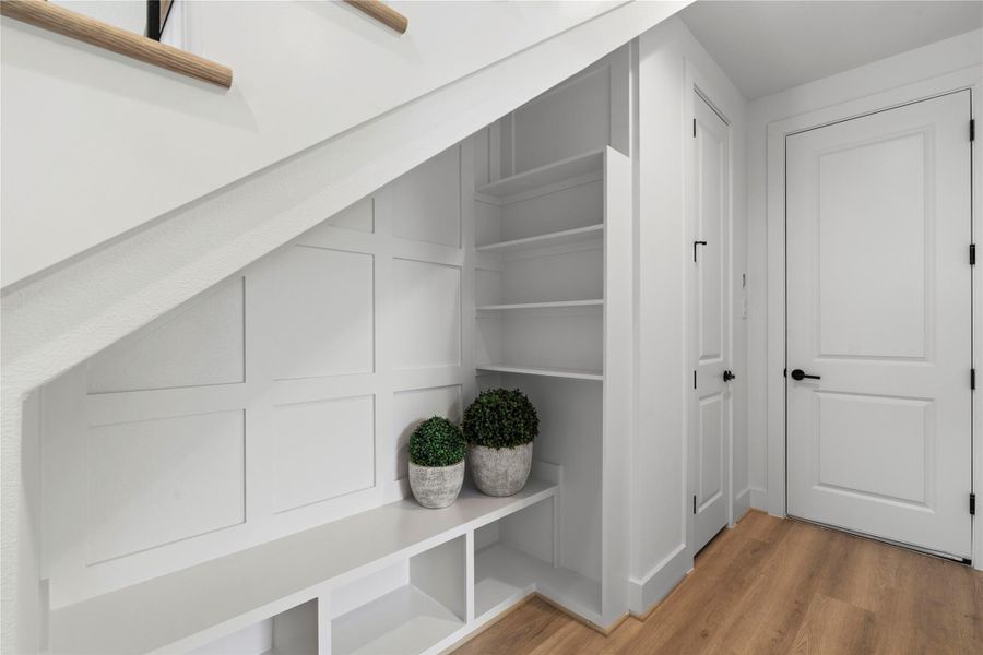 Coming in from the garage, you’ll find a coat closet and built-in mudroom area, ideal for dropping bags and shoes as you walk in. Coming in from the garage, you’ll find a coat closet and built-in mudroom area, ideal for dropping bags and shoes as you walk in.