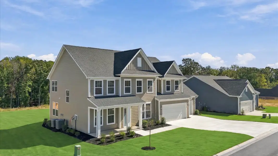Front exterior of a new home in Pinebrook, Woodruff, SC, highlighting curb appeal (Image 2). Front exterior of a new home in Pinebrook, Woodruff, SC, highlighting curb appeal (Image 2).