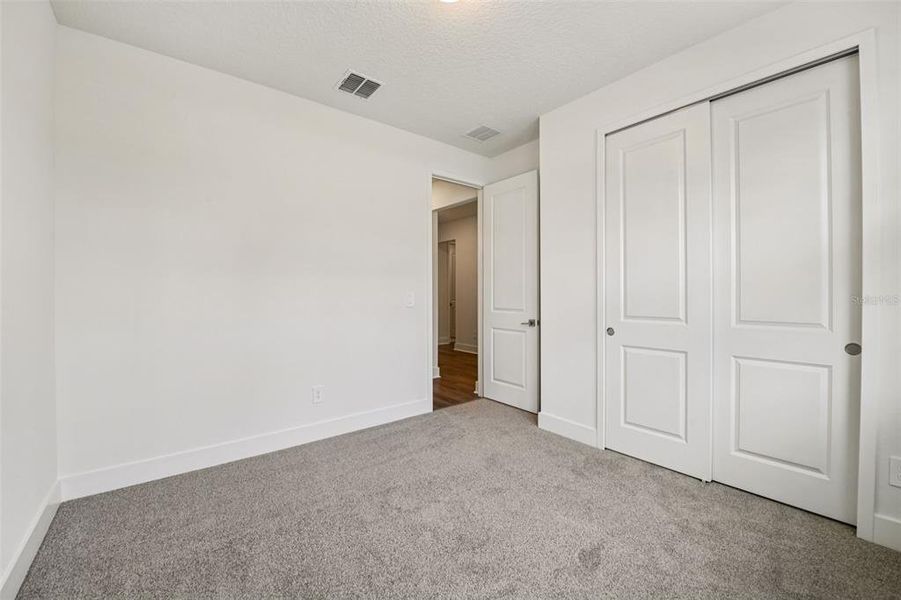 Spacious, unfurnished interior of a new home in Legends Preserve - Signature Series, Daytona Beach (Image 27).