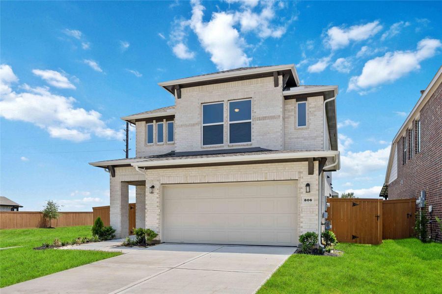 Front exterior of a new home in Emberly  45', Beasley, TX, highlighting curb appeal (Image 2).