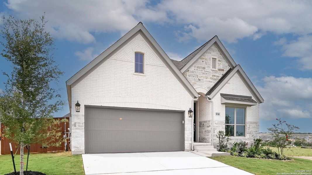 Front exterior of a new home in Homestead 55', Cibolo, TX, highlighting curb appeal (Image 25). Front exterior of a new home in Homestead 55', Cibolo, TX, highlighting curb appeal (Image 25).