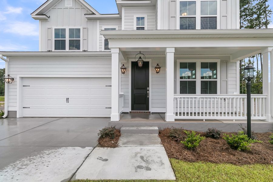 Exterior details and patio area of a home in Tidewater at Lakes of Cane Bay, Summerville (Image 3).