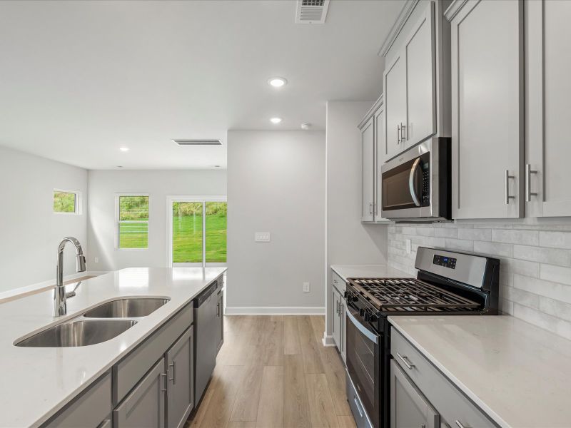 Furnished interior view inside a new home in Waterside - Boardwalk Series, Longs (Image 5).
