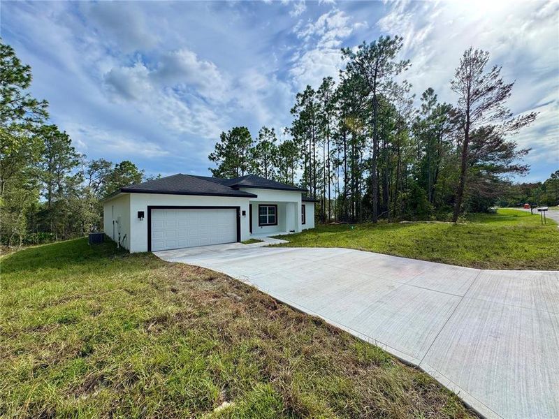 Front exterior of a new home in , Citrus Springs, FL, highlighting curb appeal (Image 20).
