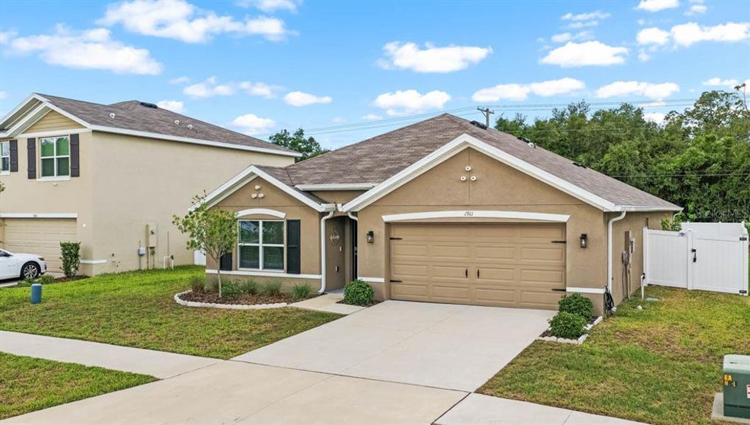 Front exterior of a new home in Brookside, Ruskin, FL, highlighting curb appeal (Image 23).