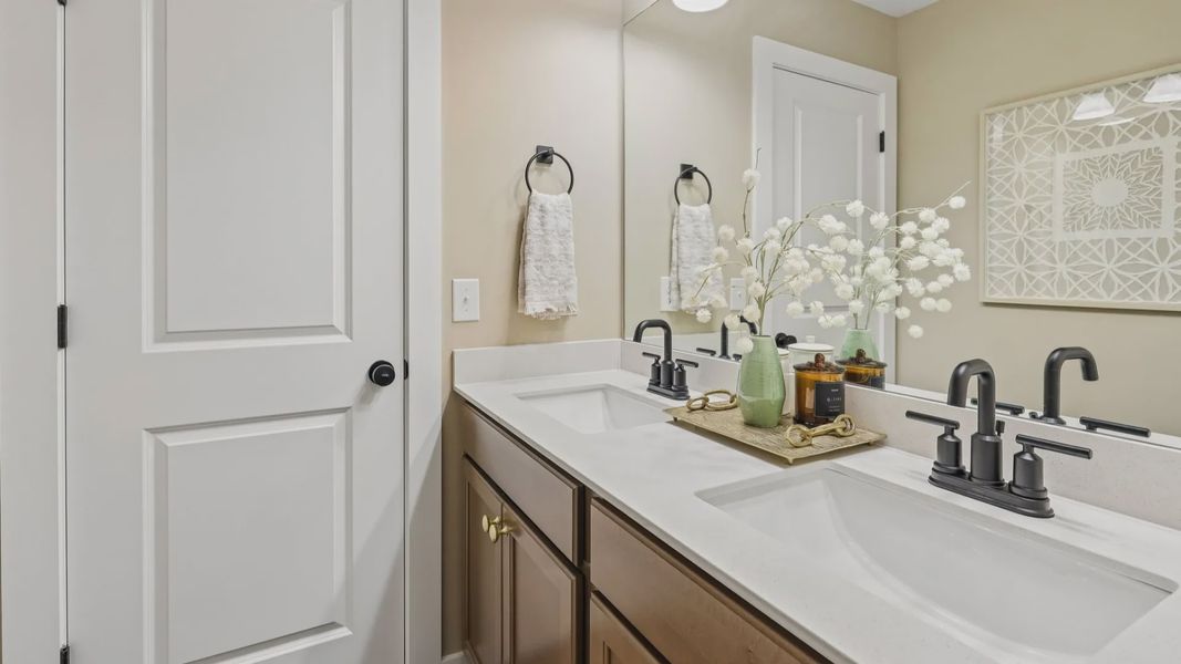 Secondary bathroom with dual vanity