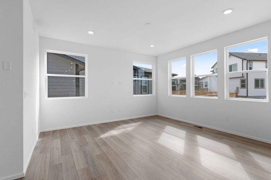 Spacious, unfurnished interior of a new home in The Cottages Collection at Ridgeline Vista, Brighton (Image 12).