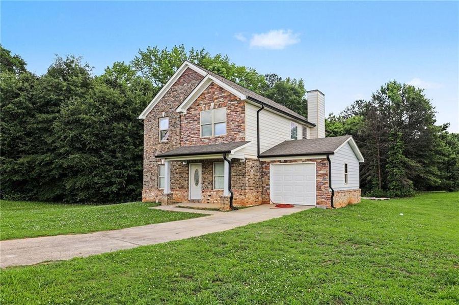Front exterior of a new home in , Jonesboro, GA, highlighting curb appeal (Image 18). Front exterior of a new home in , Jonesboro, GA, highlighting curb appeal (Image 18).