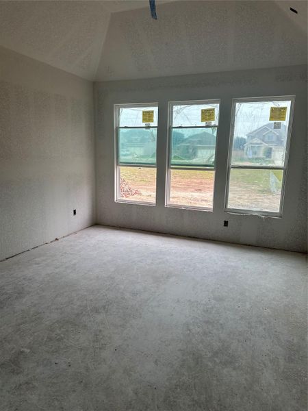 Primary Bedroom with elevated ceiling