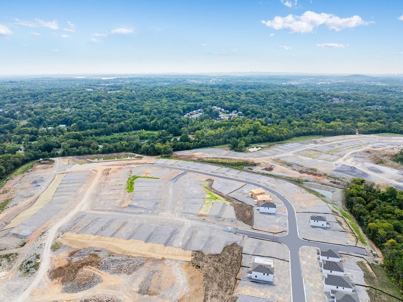 A large area with a road and trees in the background. A large area with a road and trees in the background.