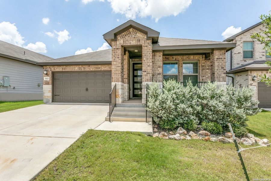 Front exterior of a new home in Lark Canyon, New Braunfels, TX, highlighting curb appeal (Image 2). Front exterior of a new home in Lark Canyon, New Braunfels, TX, highlighting curb appeal (Image 2).