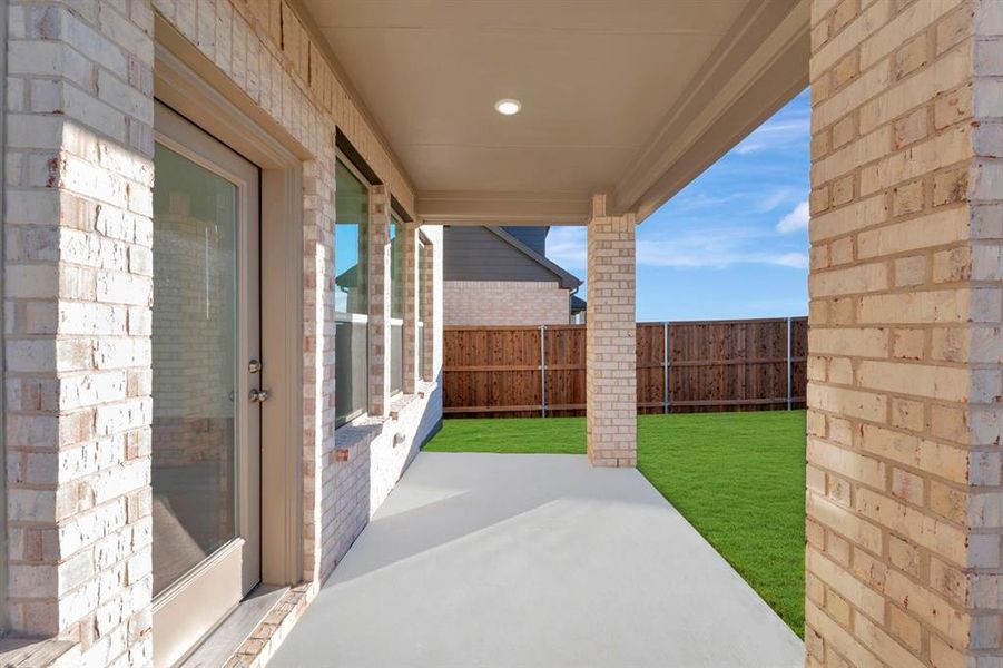 Exterior details and patio area of a home in Lily Creek at Sutton Fields, Aubrey (Image 3).