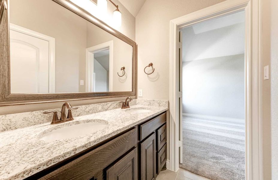 Representative furnished interior of a home built from the 4590 by Ravenna Homes in Artavia 70′, Conroe (Image 10).