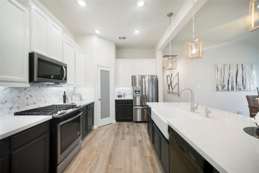 Furnished interior view inside a new home in Sunterra: Premier Collection, Katy (Image 19). Furnished interior view inside a new home in Sunterra: Premier Collection, Katy (Image 19).