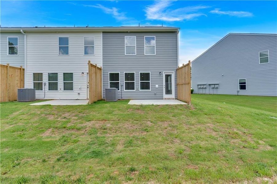 Front exterior of a new home in Village Green, Adairsville, GA, highlighting curb appeal (Image 27).
