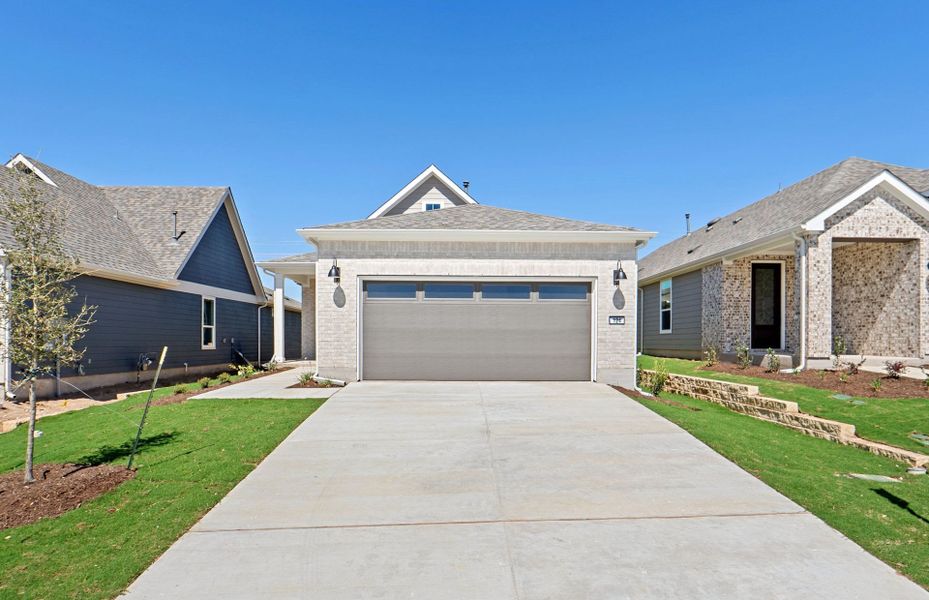 Front exterior of a new home in Sun City Texas, Georgetown, TX, highlighting curb appeal (Image 19).