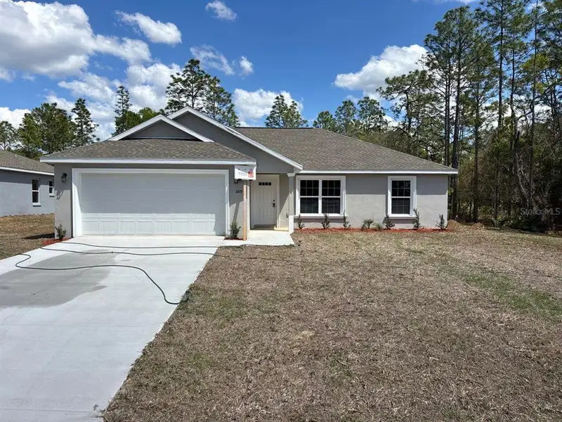 Front exterior of a new home in , Dunnellon, FL, highlighting curb appeal (Image 1). Front exterior of a new home in , Dunnellon, FL, highlighting curb appeal (Image 1).
