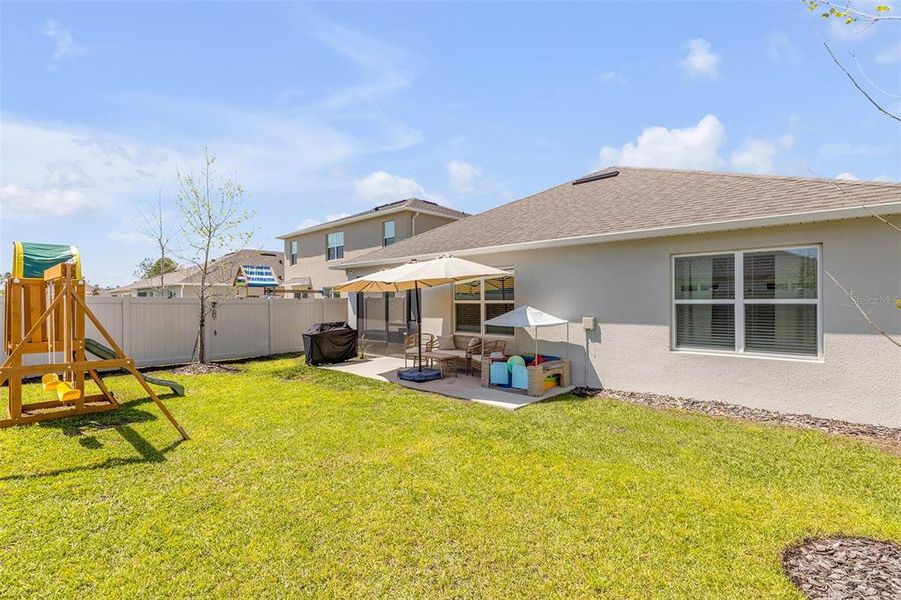 Exterior details and patio area of a home in Groveside at Ormond Station, Ormond Beach (Image 24).